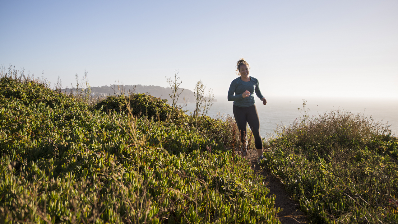 woman running on trail