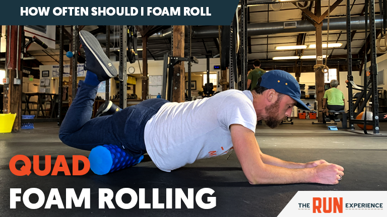 man foam rolling quads